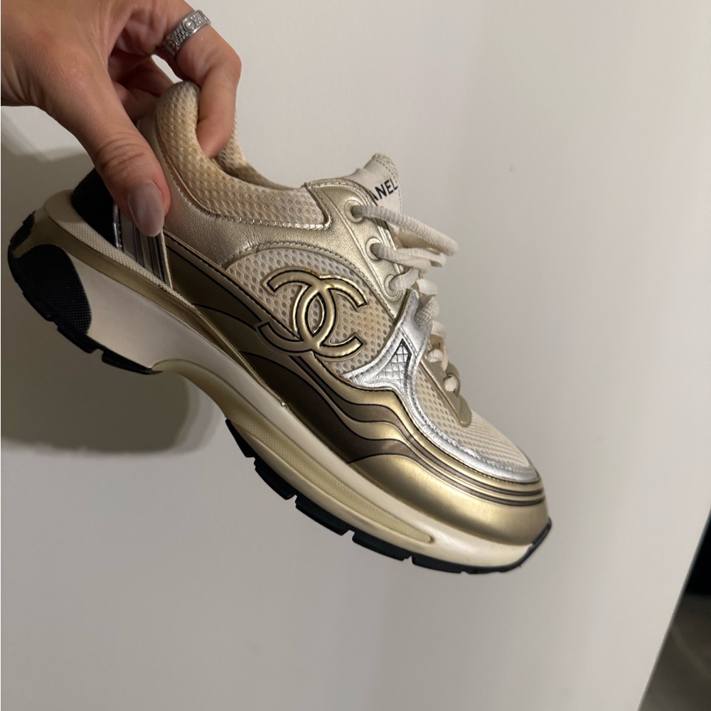 CHANEL Gold and Black Sneakers with Iconic Logo